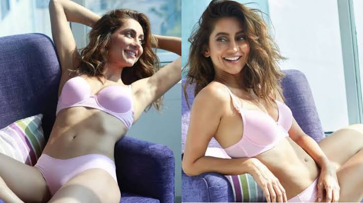 ANUSHA DANDEKAR WEARING A TWO-PIECE GAVE A BO*LD POSE LYING ON THE COUCH